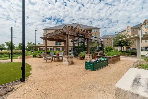 a view of a chairs and table in the patio