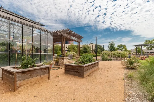 a view of a swimming pool and trees in the background