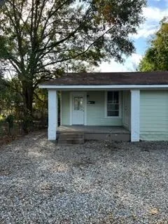a house with trees in the background