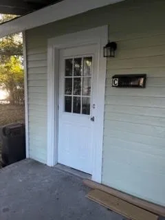 a view of front door and bedroom