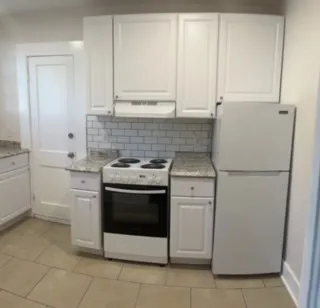 a bathroom with a toilet and shower