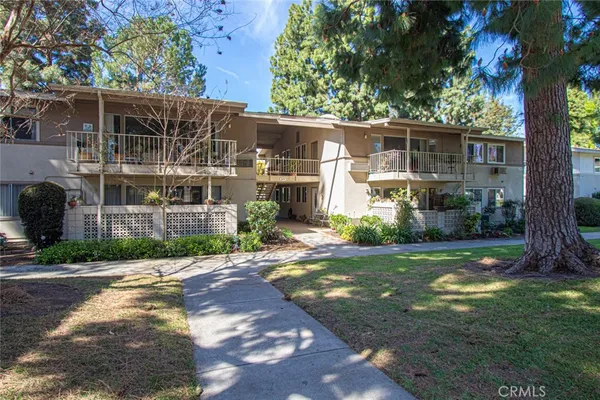 a view of backyard of house with green space