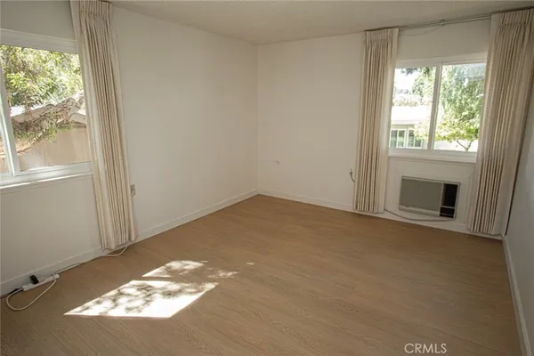 a view of a room that has a window in it