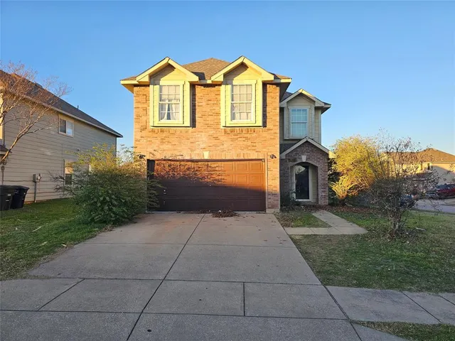 a view of open space in front of a house with a yard