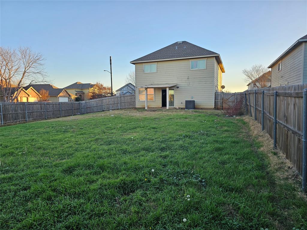237 Cres Ridge Drive Fort Worth, TX 76140 - Photo 11 of 11 a front view of a house with a yard and garage
