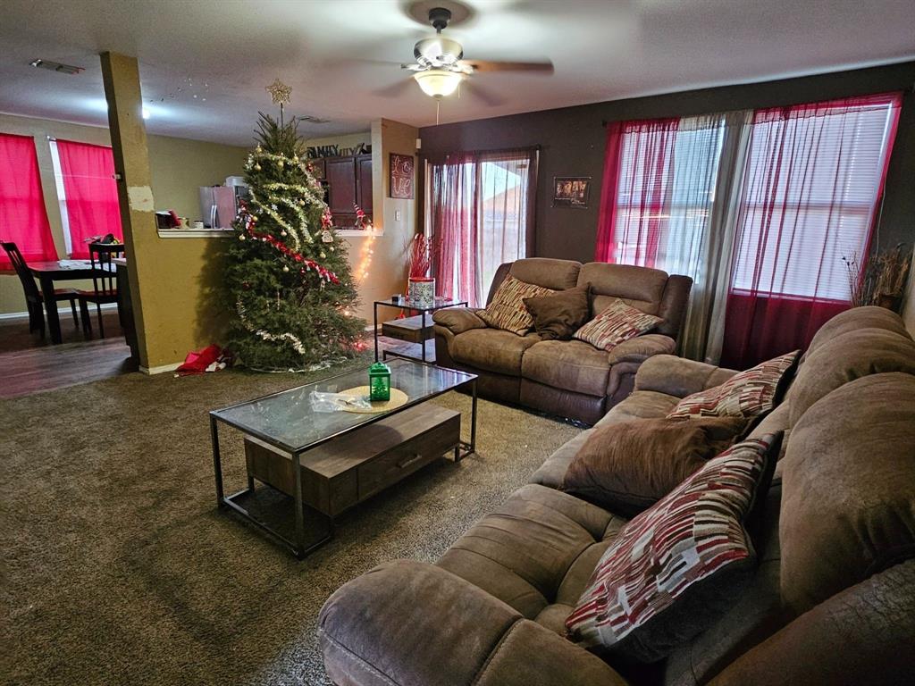 237 Cres Ridge Drive Fort Worth, TX 76140 - Photo 3 of 11 a living room with furniture and a chandelier