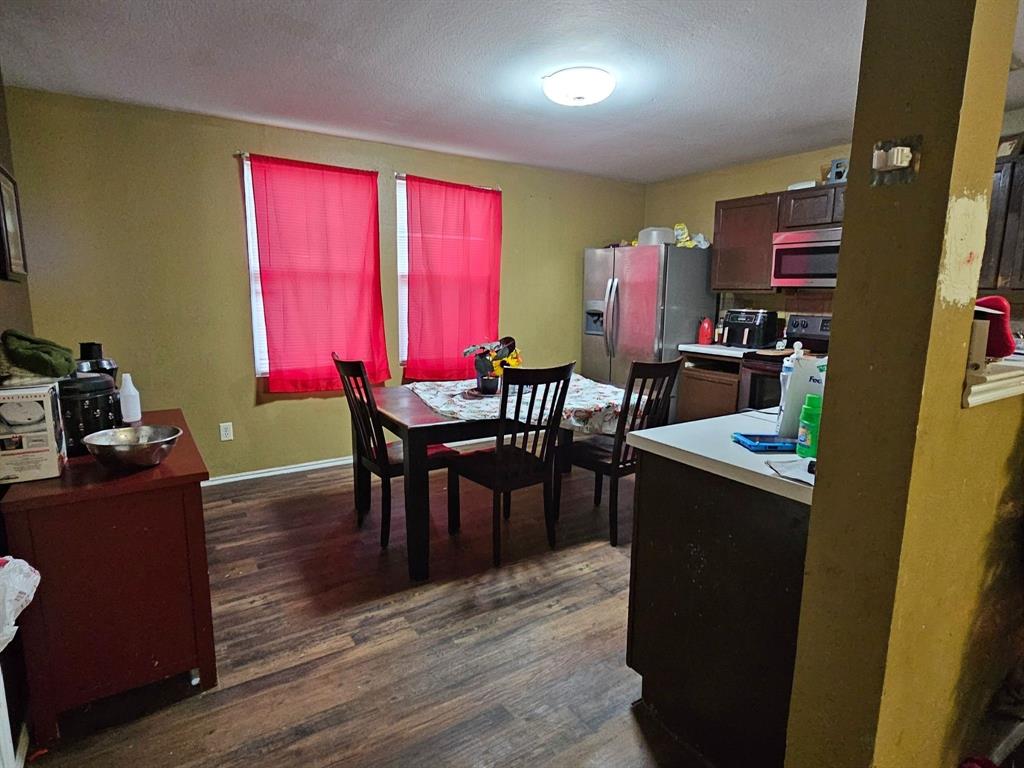 237 Cres Ridge Drive Fort Worth, TX 76140 - Photo 5 of 11 a dining room with furniture and wooden floor