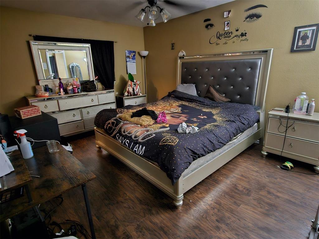 237 Cres Ridge Drive Fort Worth, TX 76140 - Photo 8 of 11 a bedroom with a bed window and dresser