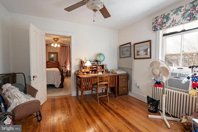 a room with furniture and wooden floor