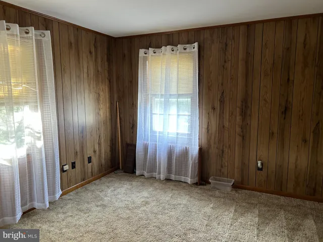 a kitchen with refrigerator and window