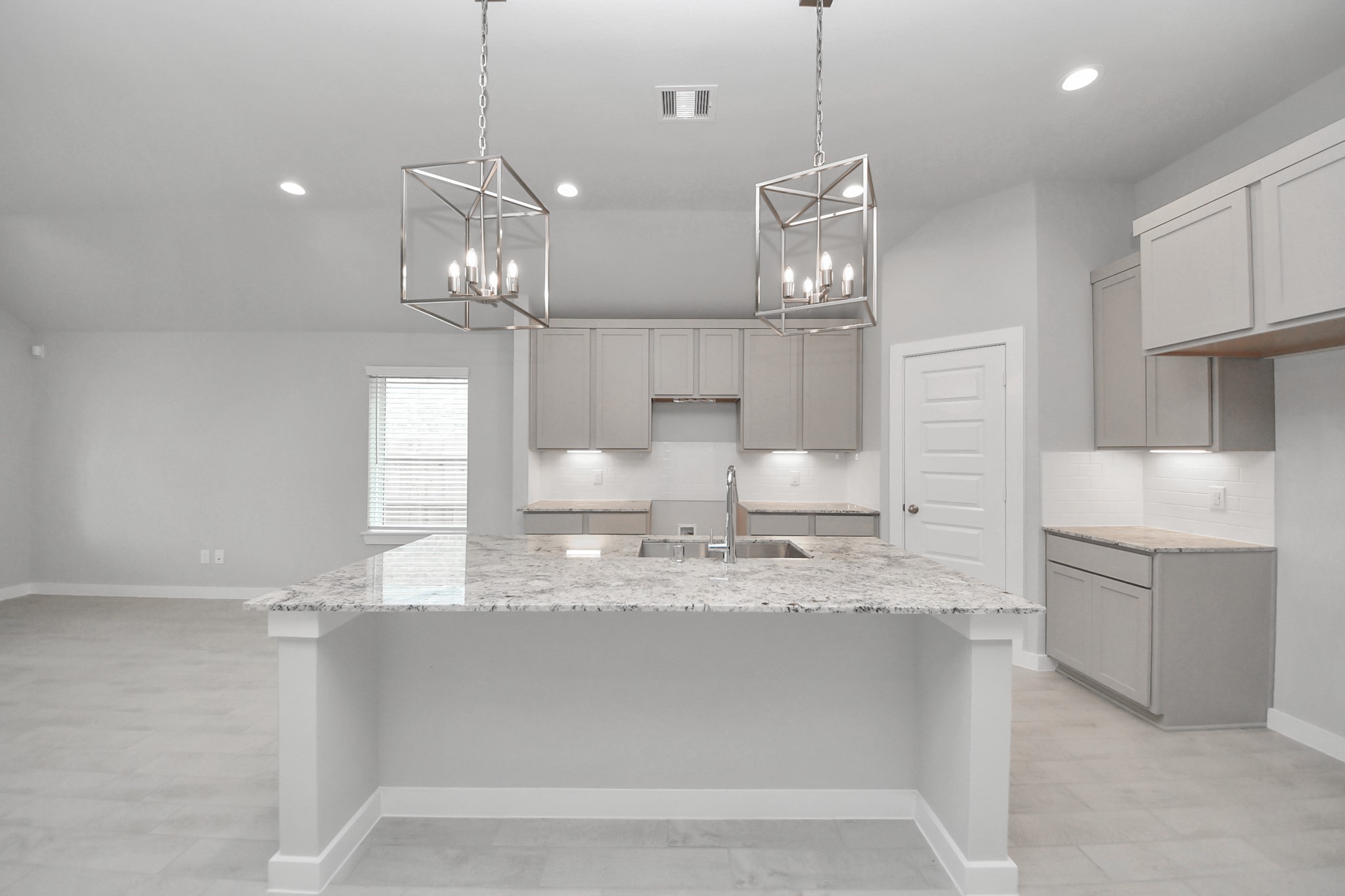 24518 Broad Park Spring, TX 77373 - Photo 9 of 29 The kitchen is a culinary haven, featuring granite countertops, a tile backsplash, stainless steel appliances, 42” upper cabinets, and undercabinet lighting. Sample photo of completed home with similar floor plan. Actual colors and selections may vary.