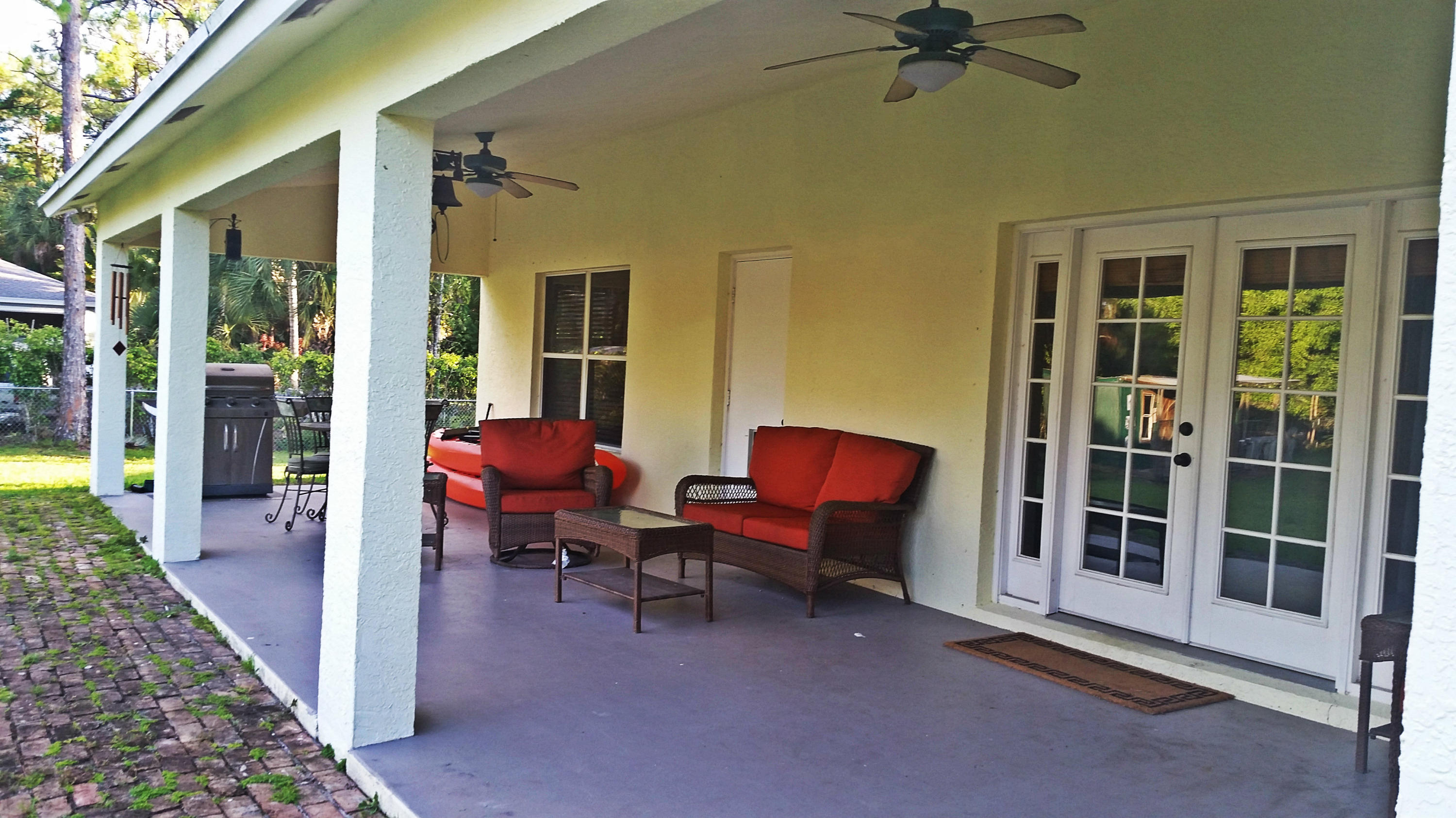 6098 Indian Trail Ranch Road Loxahatchee, FL 33470 - Photo 28 of 39 Back Covered Patio