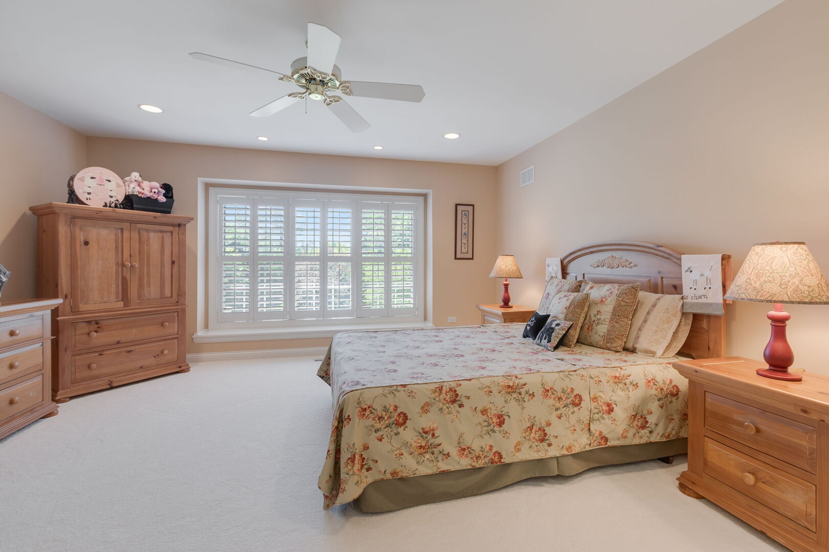 209 Carriage Trail Barrington, IL 60010 - Photo 25 of 42 a bedroom with a bed and a chandelier