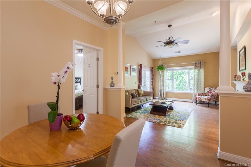 5730 Closeburn Road, Unit M Charlotte, NC 28210 - Photo 2 of 21 a living room with furniture kitchen island granite countertop furniture and a wooden floor