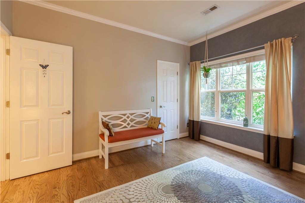 5730 Closeburn Road, Unit M Charlotte, NC 28210 - Photo 15 of 21 a bedroom with a bed and a window