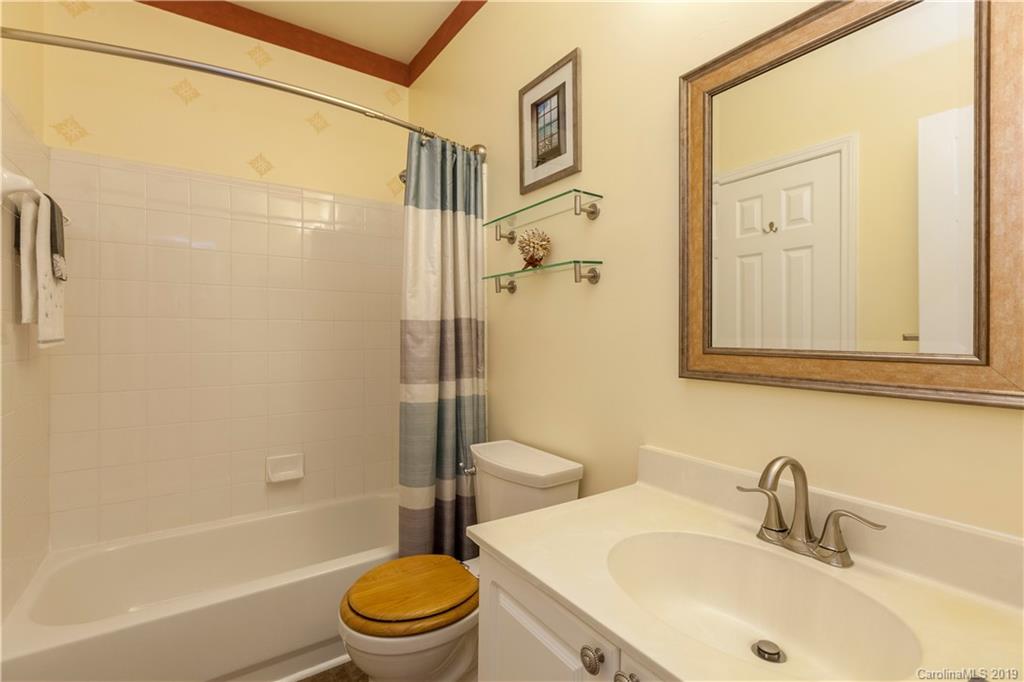 5730 Closeburn Road, Unit M Charlotte, NC 28210 - Photo 16 of 21 a bathroom with a sink toilet and shower