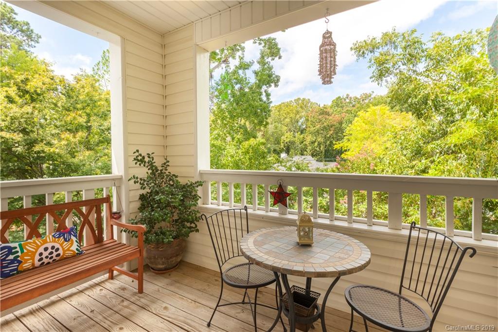 5730 Closeburn Road, Unit M Charlotte, NC 28210 - Photo 17 of 21 a balcony with couple of chairs and wooden floor