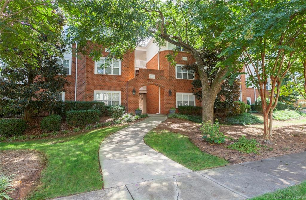 5730 Closeburn Road, Unit M Charlotte, NC 28210 - Photo 20 of 21 a front view of a house with garden