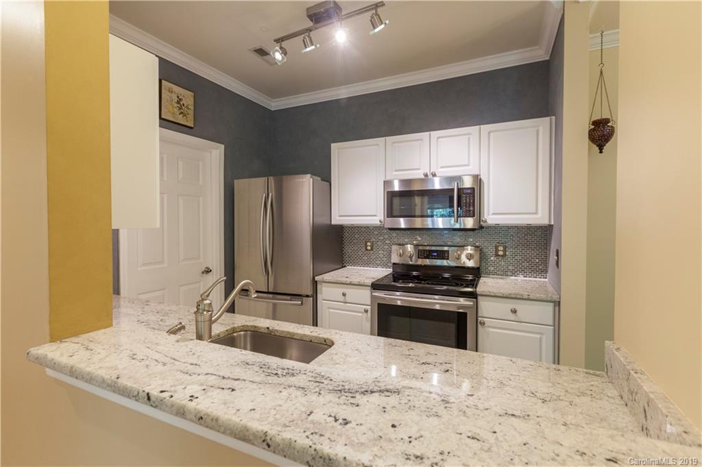 5730 Closeburn Road, Unit M Charlotte, NC 28210 - Photo 7 of 21 a kitchen with a sink stove and refrigerator