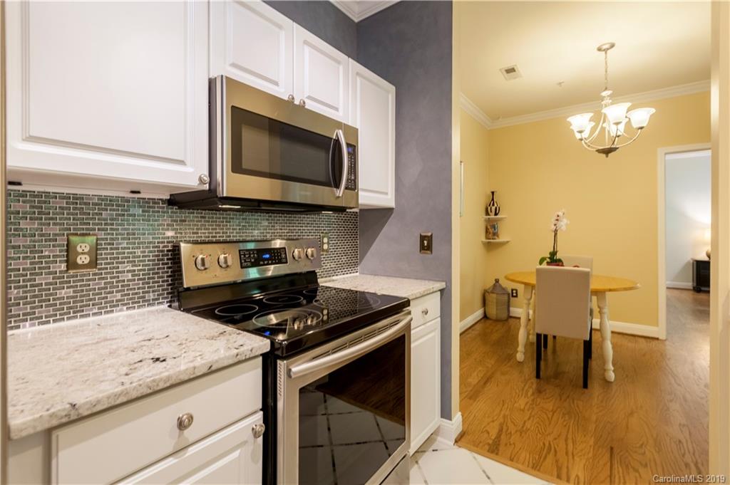 5730 Closeburn Road, Unit M Charlotte, NC 28210 - Photo 8 of 21 a kitchen with a stove and a microwave