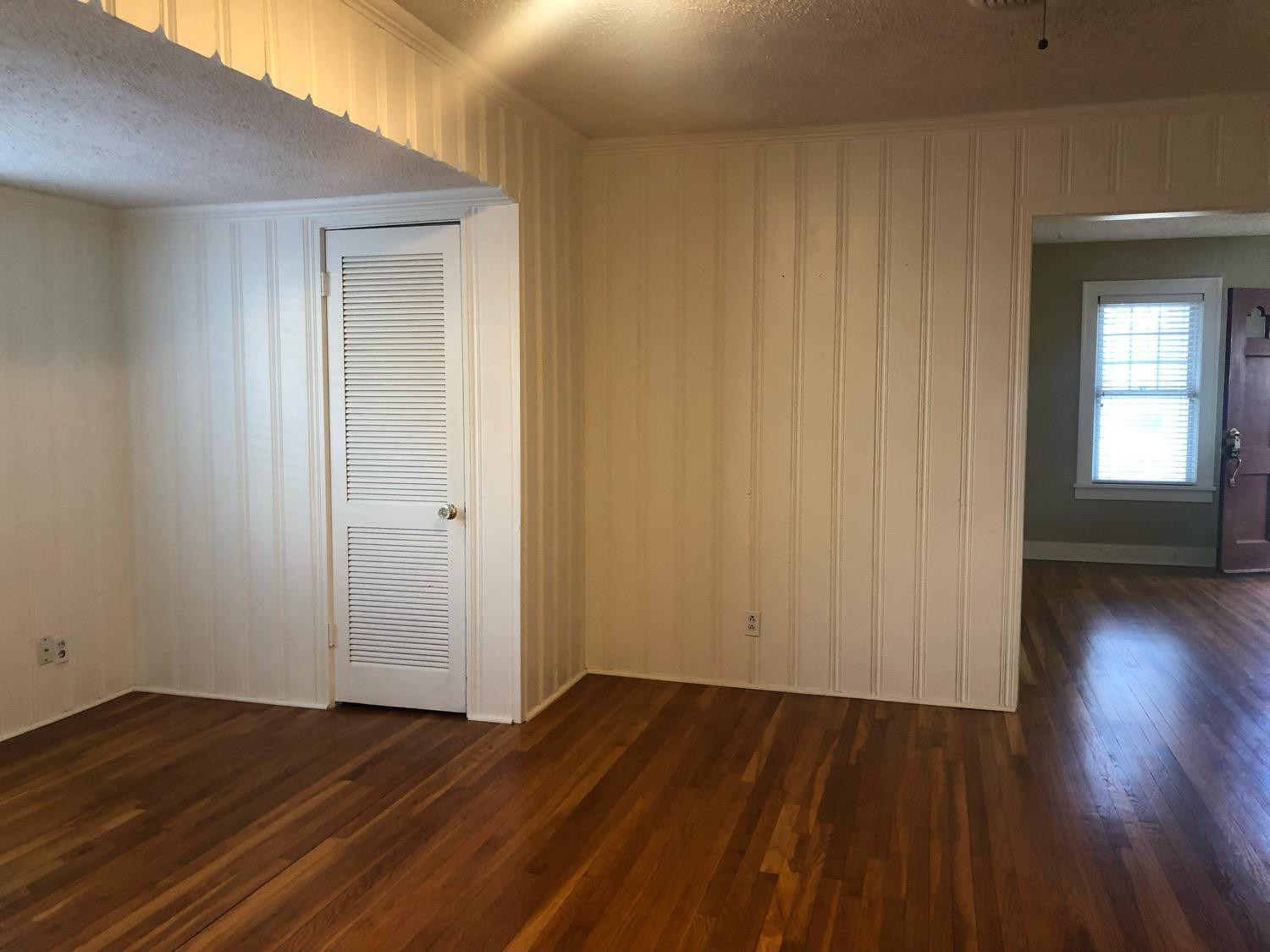 2904 20th Street Lubbock, TX 79410 - Photo 13 of 35 an empty room with wooden floor and windows