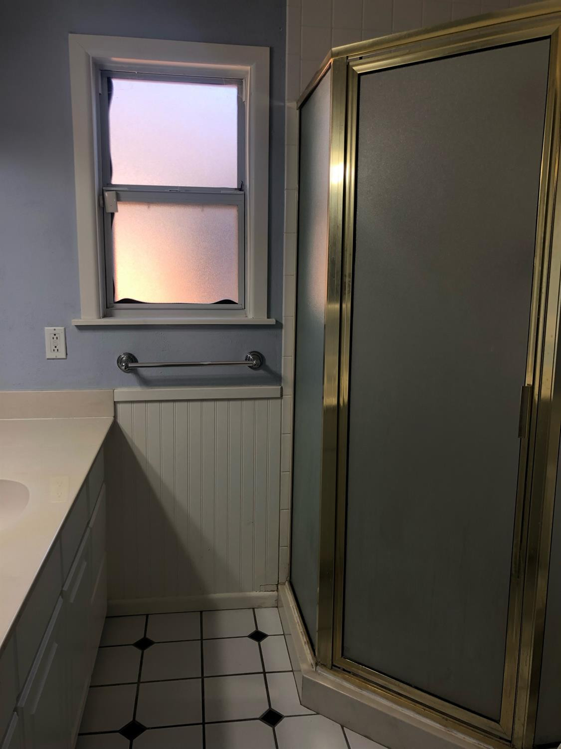 2904 20th Street Lubbock, TX 79410 - Photo 26 of 35 a bathroom with a sink and a mirror