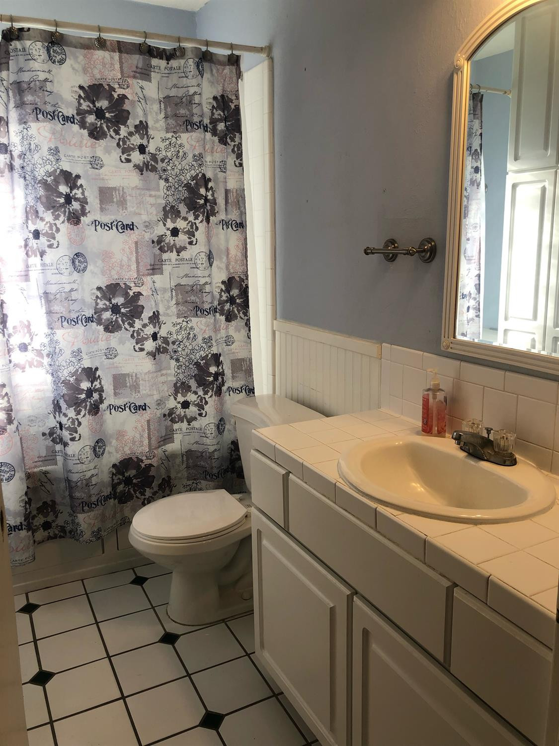 2904 20th Street Lubbock, TX 79410 - Photo 31 of 35 a bathroom with a sink toilet and shower