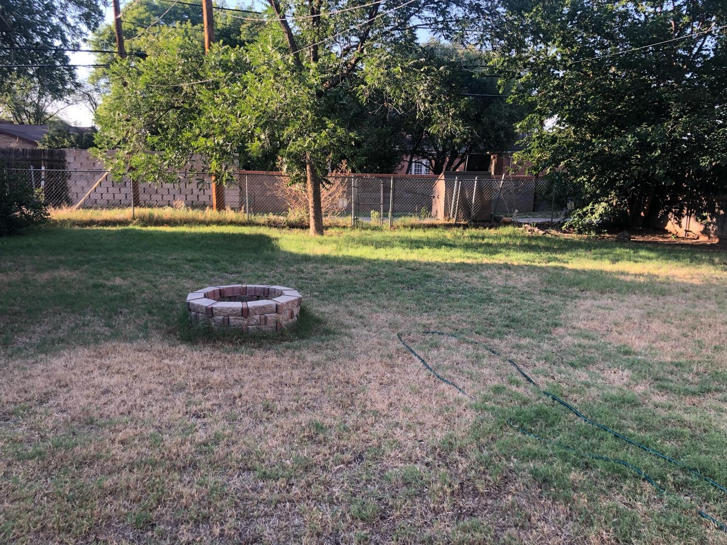 2904 20th Street Lubbock, TX 79410 - Photo 35 of 35 a view of a backyard with a garden and trees