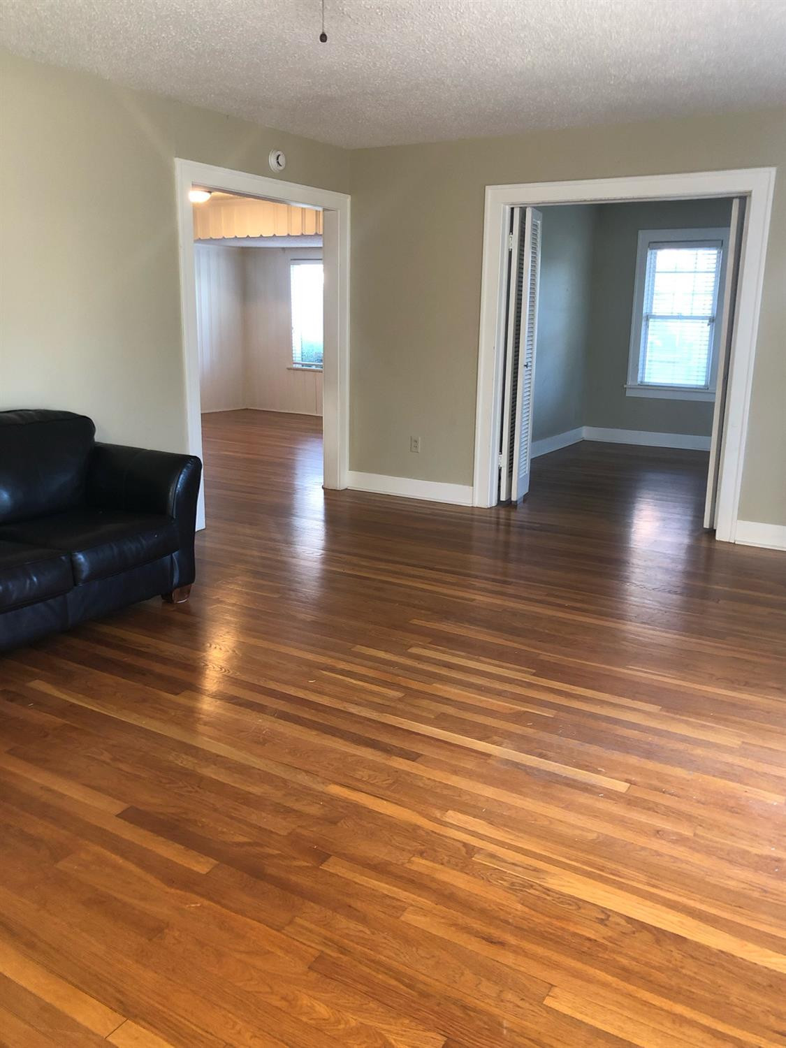 2904 20th Street Lubbock, TX 79410 - Photo 7 of 35 wooden floor in an empty room with a window