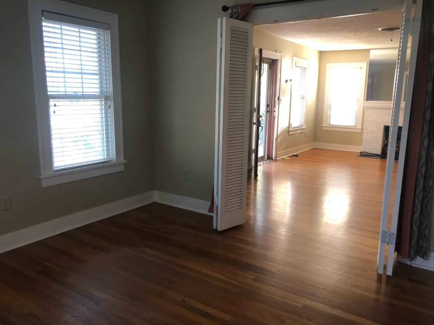 2904 20th Street Lubbock, TX 79410 - Photo 8 of 35 an empty room with wooden floor and windows