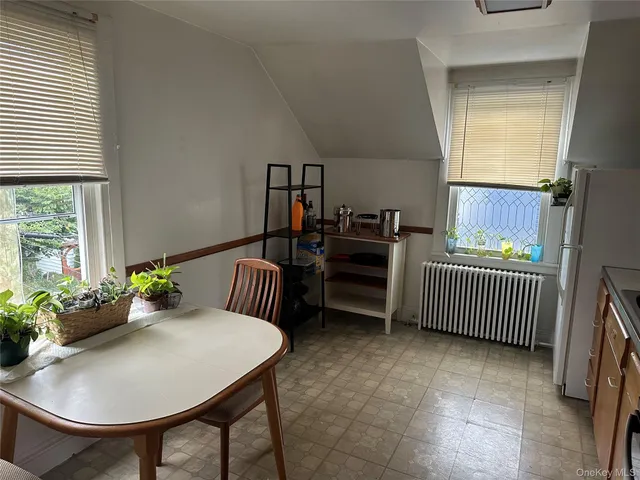 a workspace with furniture and a window