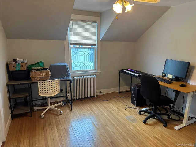 a bedroom with bed and a window