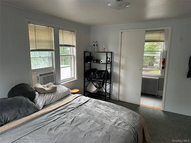 a bathroom with sink toilet and shower