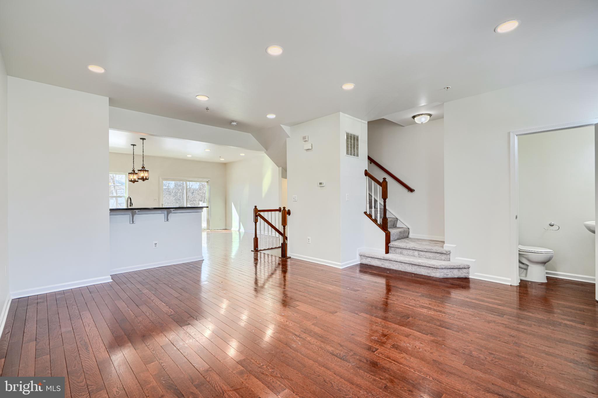 7366 Matchbox Alley Elkridge, MD 21075 - Photo 18 of 32 a view of entryway and hall with wooden floor