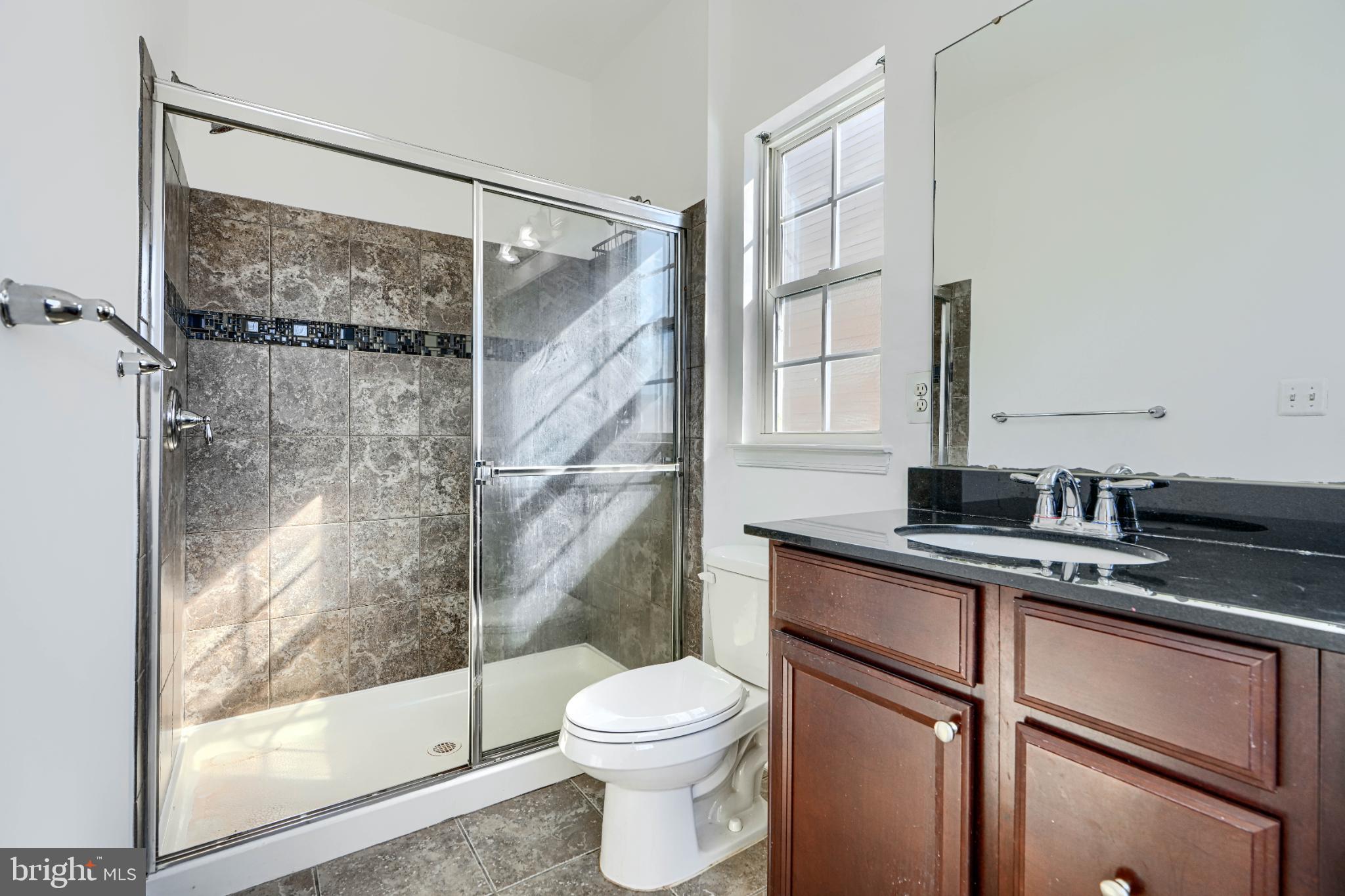 7366 Matchbox Alley Elkridge, MD 21075 - Photo 23 of 32 a bathroom with a sink toilet and shower