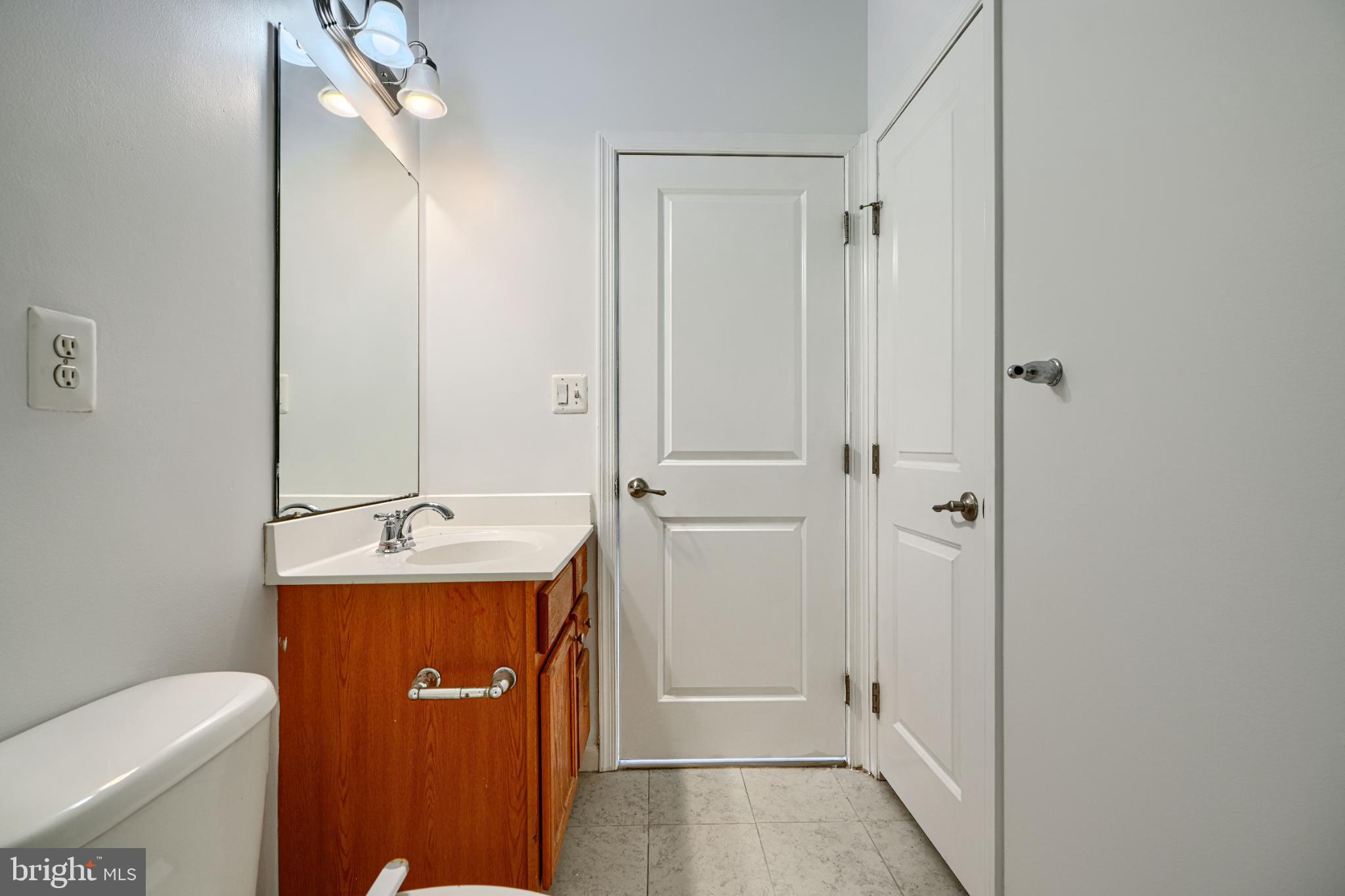 7366 Matchbox Alley Elkridge, MD 21075 - Photo 28 of 32 a bathroom with a sink a toilet and shower