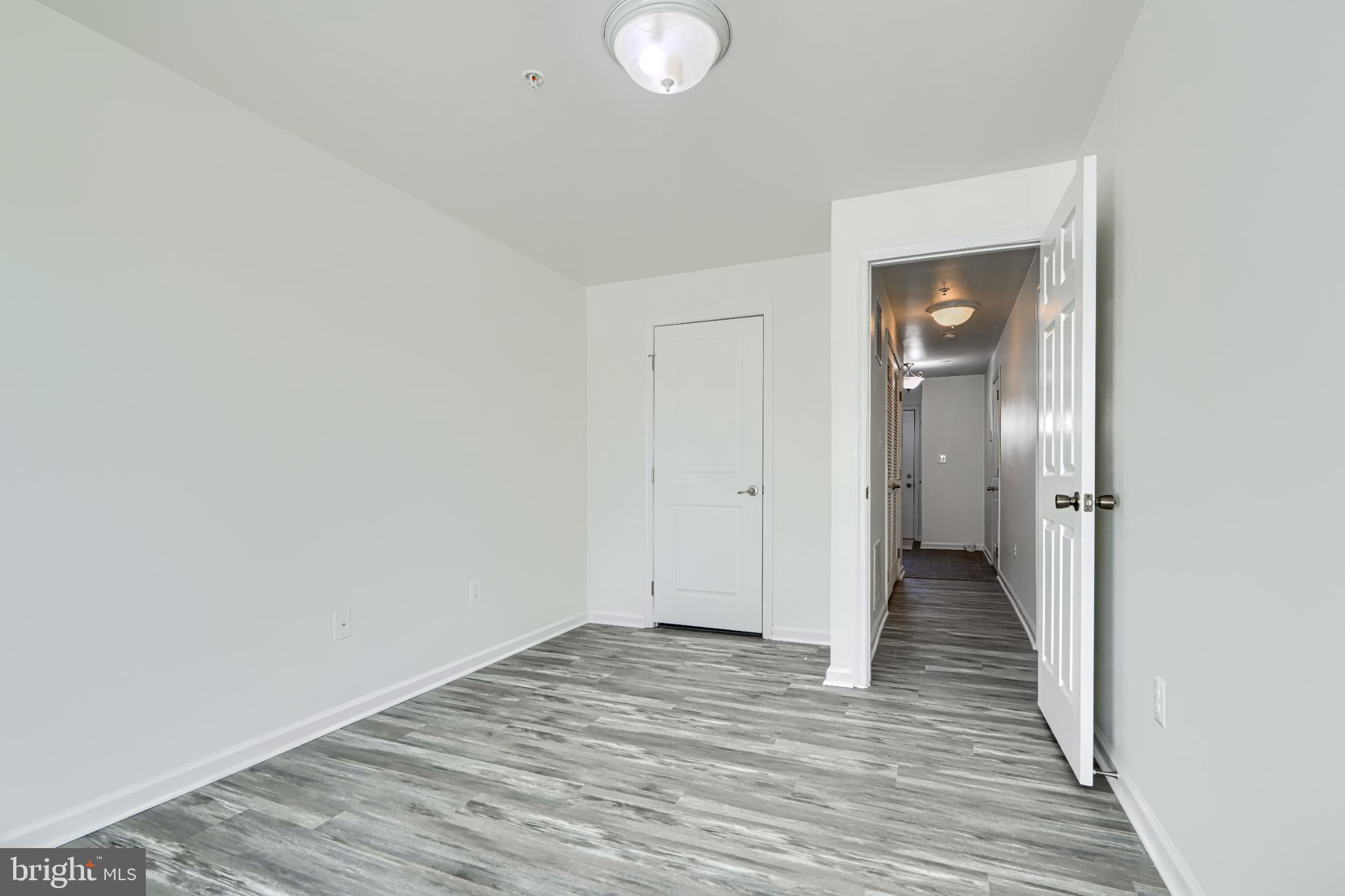 7366 Matchbox Alley Elkridge, MD 21075 - Photo 5 of 32 a view of a livingroom from a hallway
