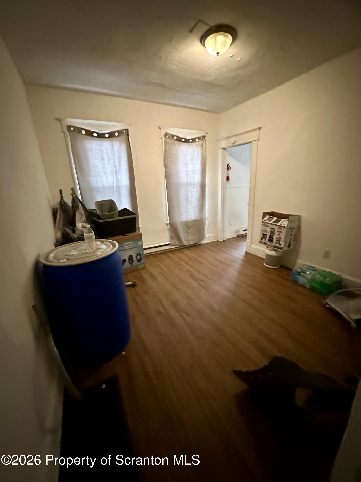 1129-1131 Hampton Street Scranton, PA 18504 - Photo 12 of 45 a bedroom with a bed and a dresser