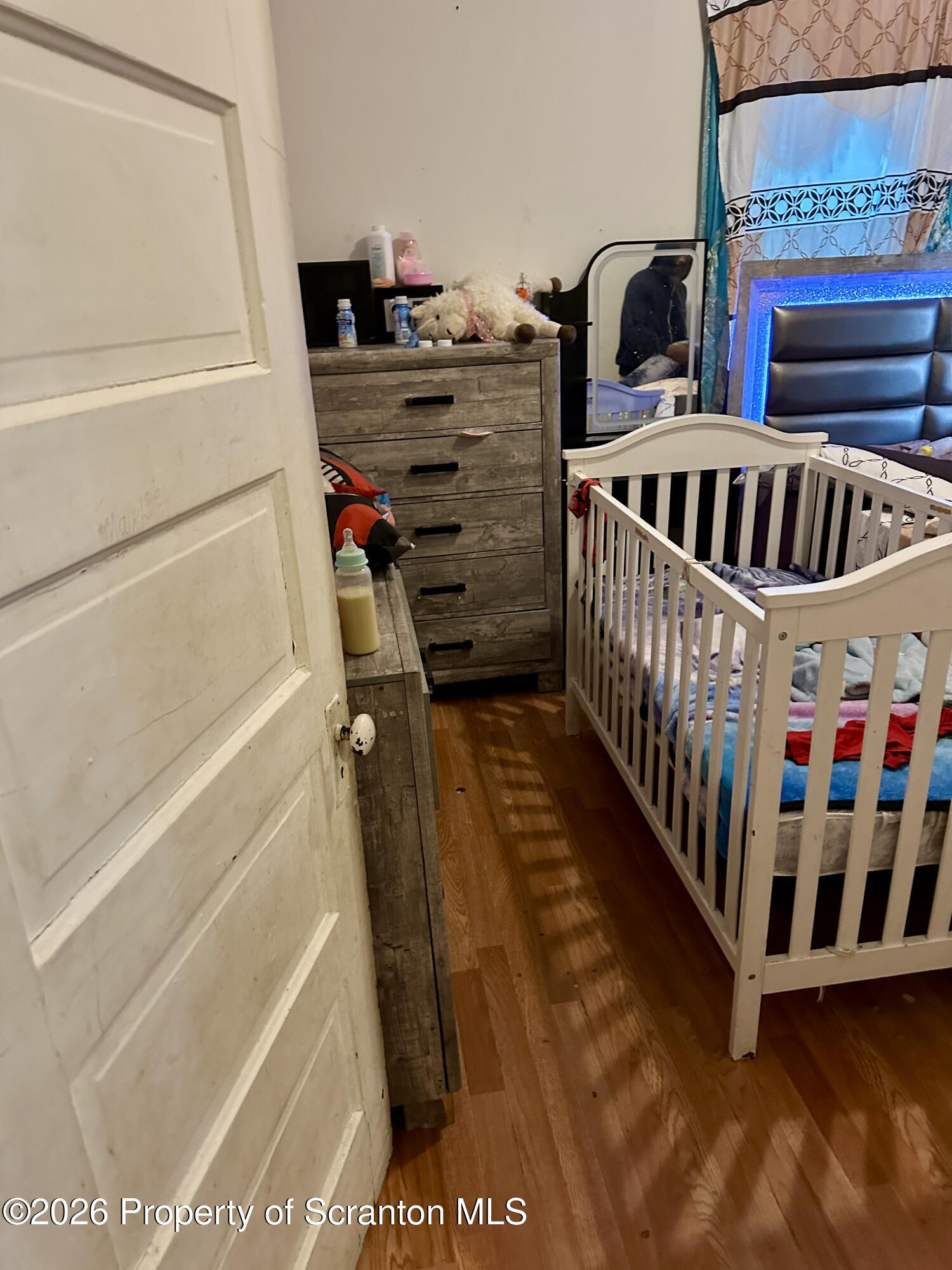 1129-1131 Hampton Street Scranton, PA 18504 - Photo 30 of 45 a view of kids room with baby crib