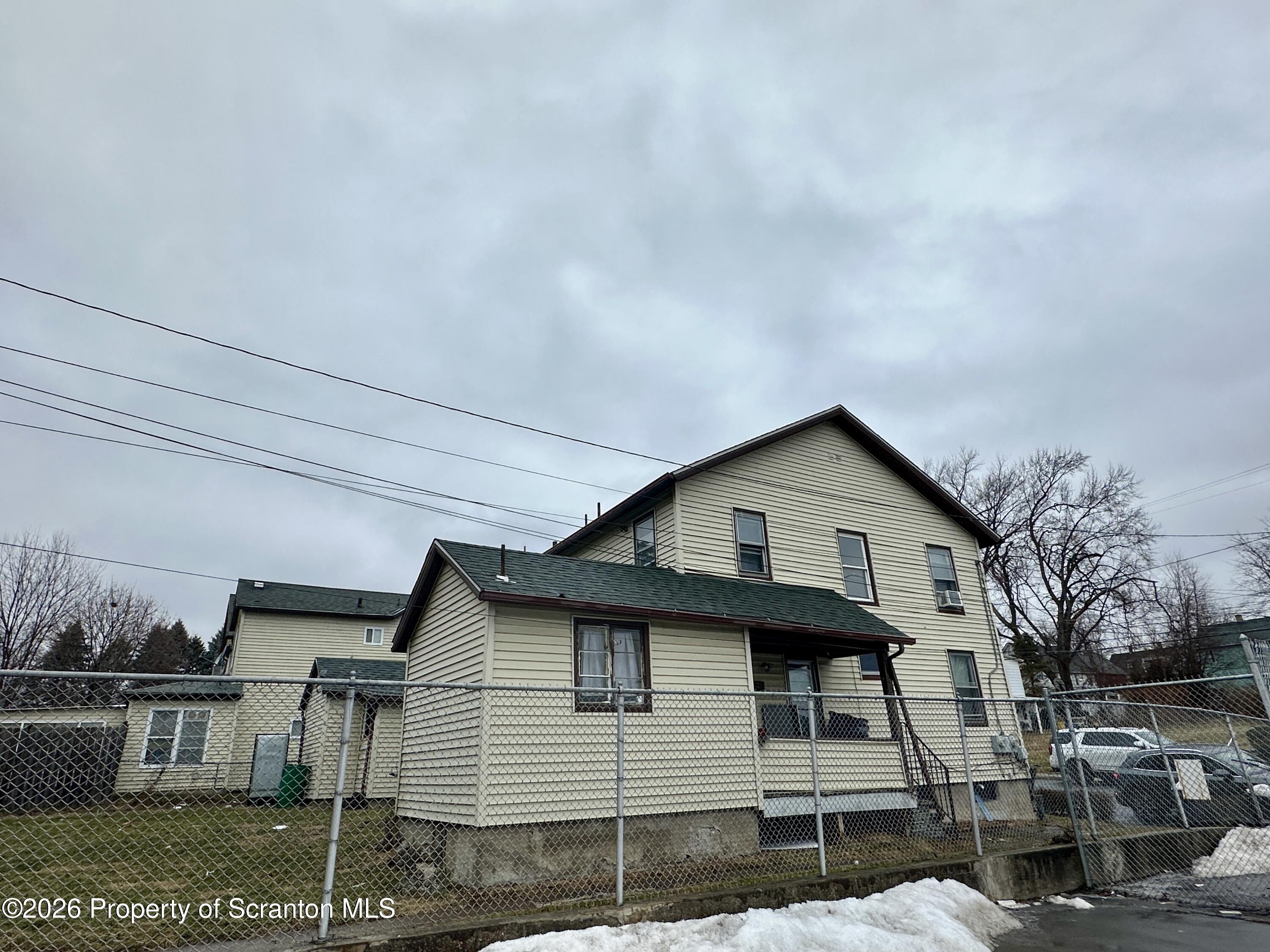 1129-1131 Hampton Street Scranton, PA 18504 - Photo 3 of 45 a front view of a house with garage