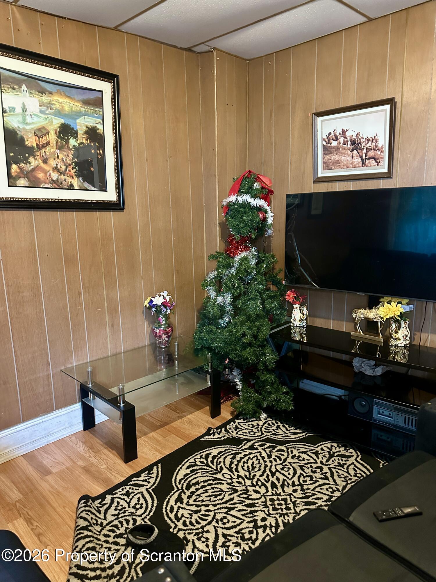 1129-1131 Hampton Street Scranton, PA 18504 - Photo 31 of 45 a living room with furniture and flowers