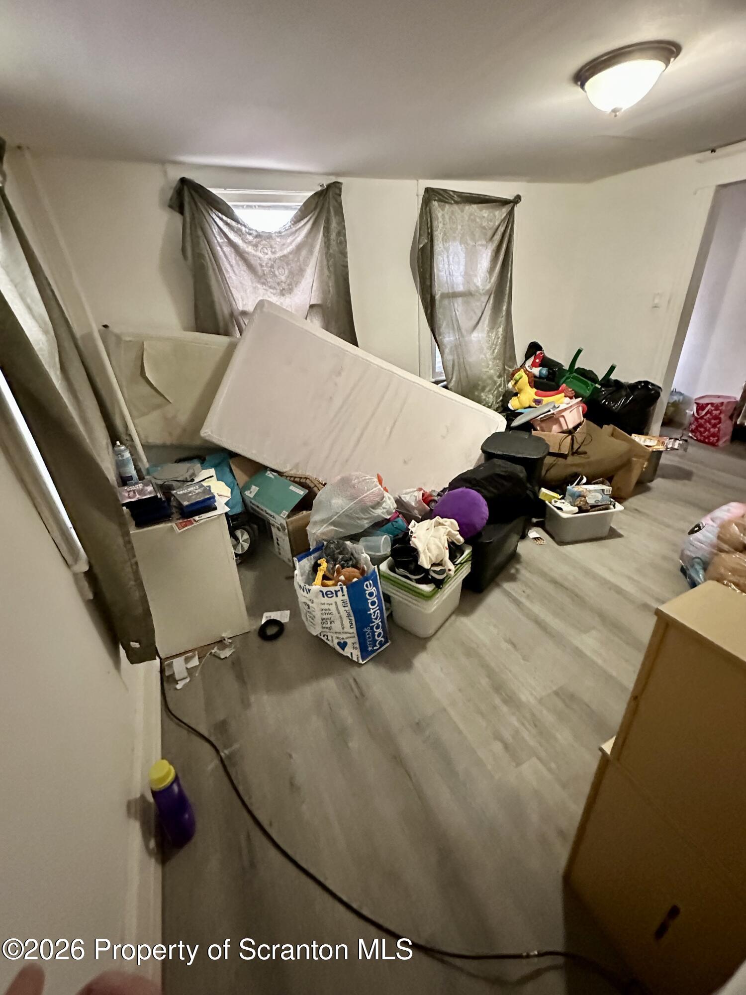 1129-1131 Hampton Street Scranton, PA 18504 - Photo 36 of 45 a view of gym equipment and a living room view