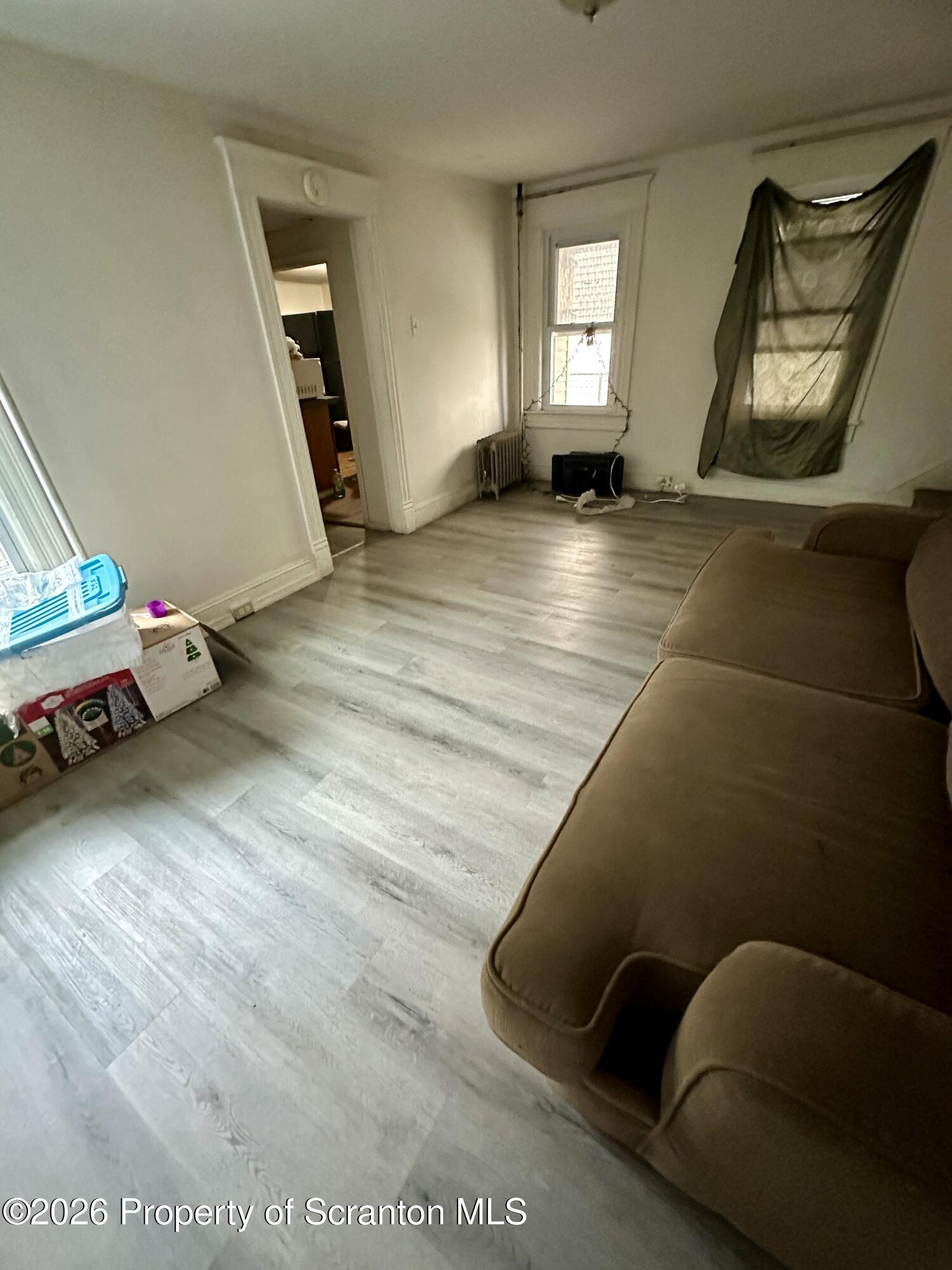 1129-1131 Hampton Street Scranton, PA 18504 - Photo 37 of 45 a view of an empty room and wooden floor