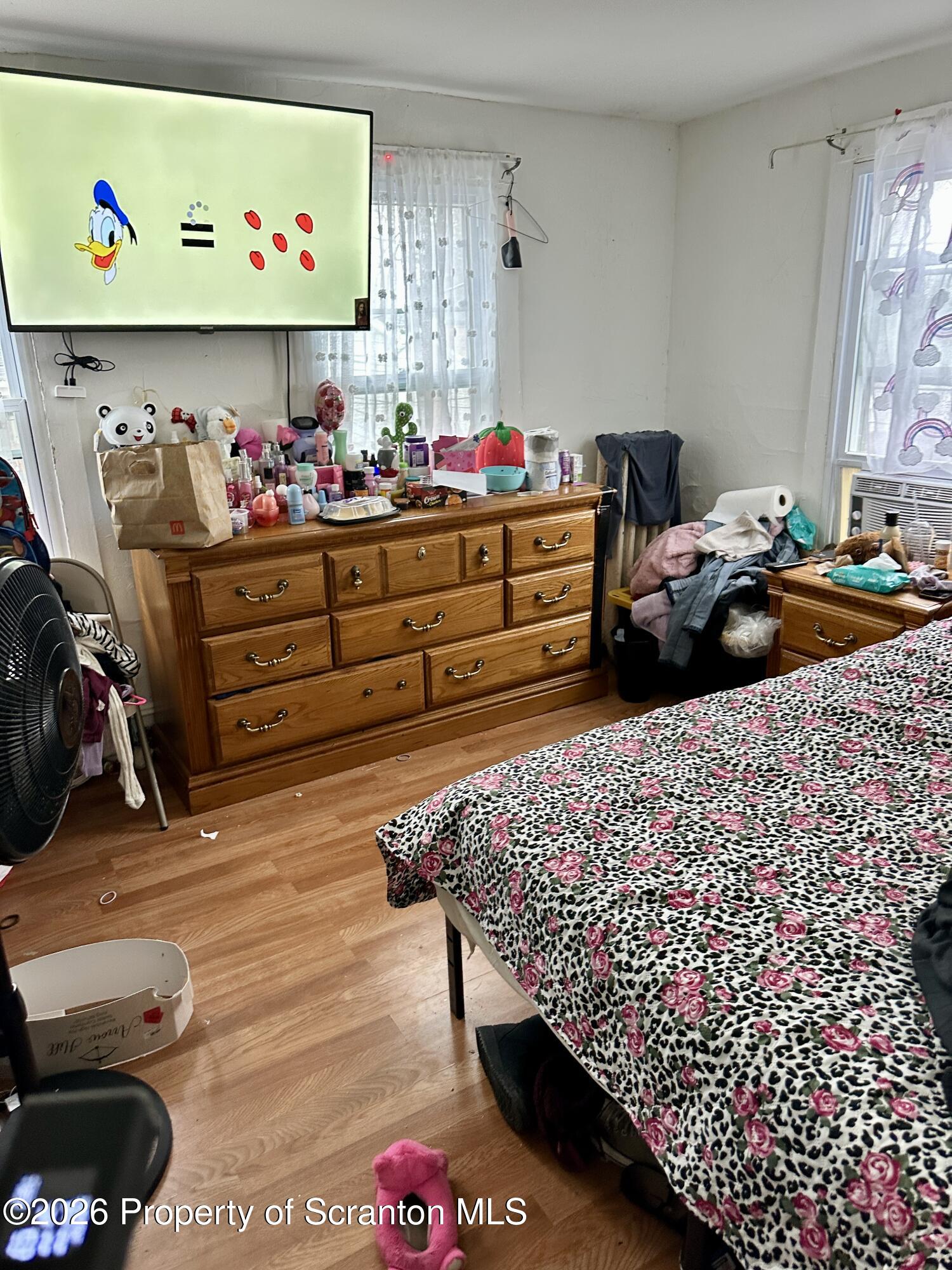 1129-1131 Hampton Street Scranton, PA 18504 - Photo 42 of 45 a bed room with a bed and a window