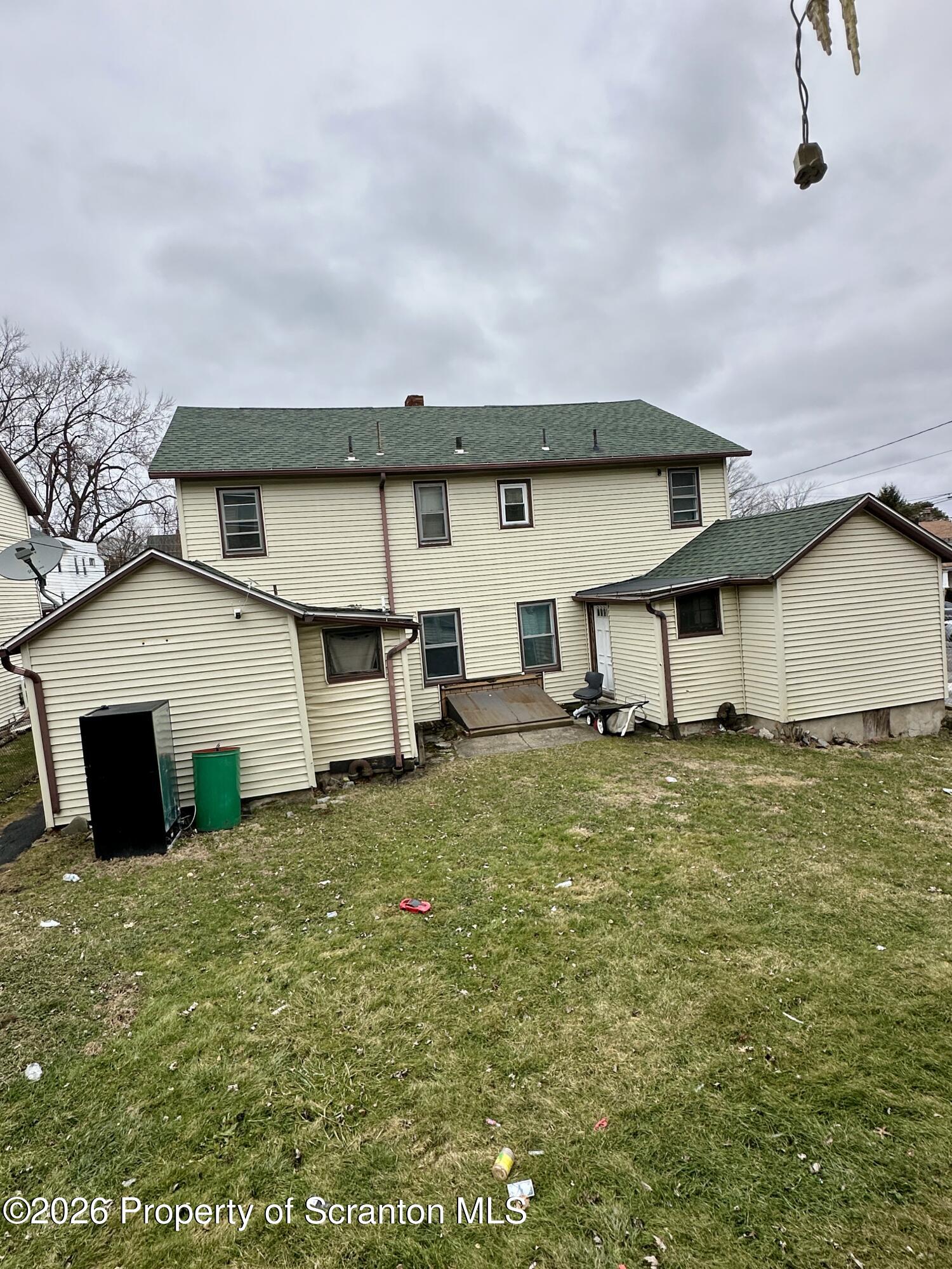 1129-1131 Hampton Street Scranton, PA 18504 - Photo 7 of 45 a house view with a garden space