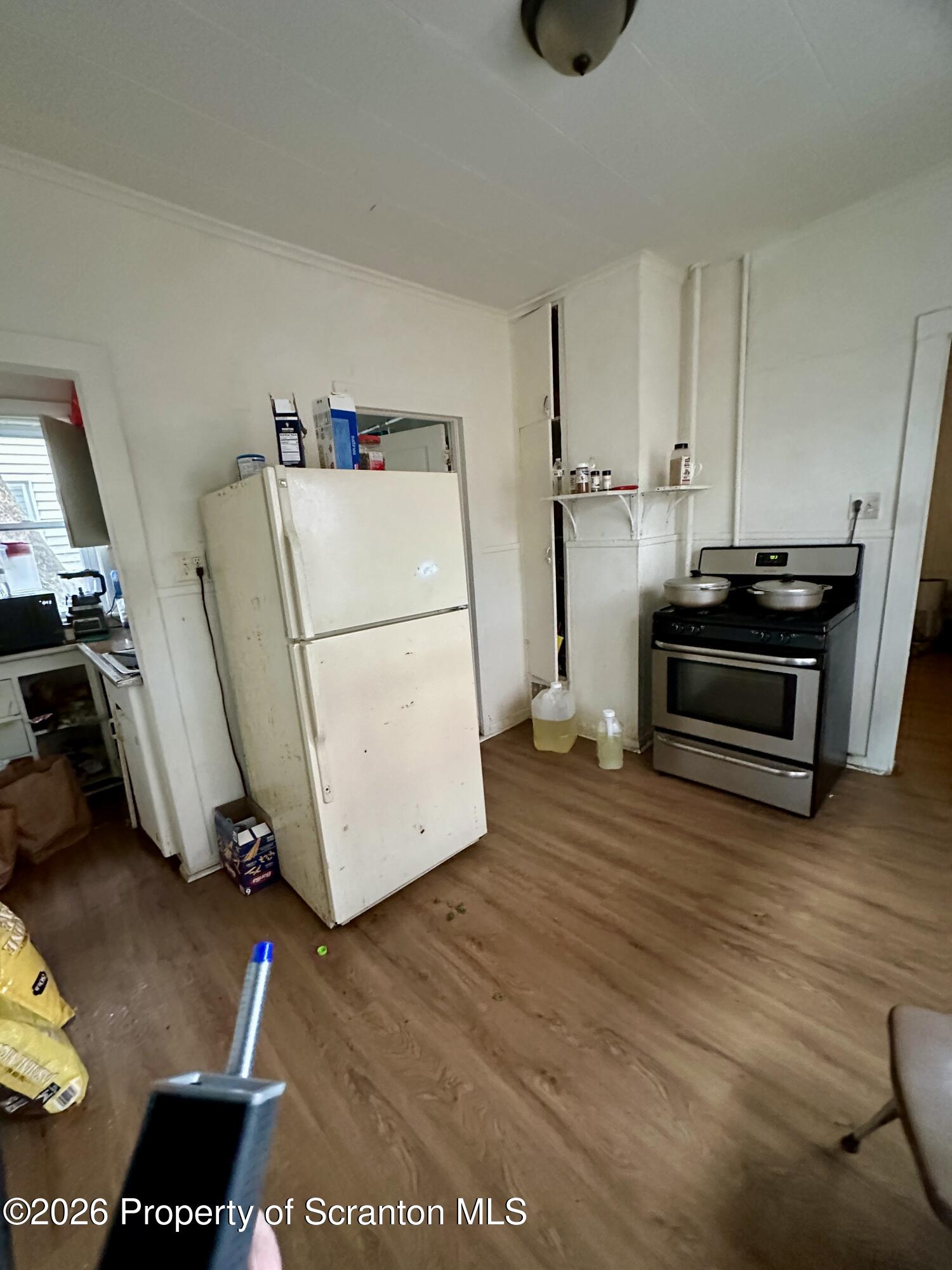 1129-1131 Hampton Street Scranton, PA 18504 - Photo 10 of 45 a view of kitchen with a sink wooden floor and electronic appliances