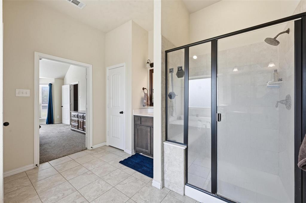 144 Brady Coleman Lane Springtown, TX 76082 - Photo 20 of 37 a view of a bathroom with a glass door shower