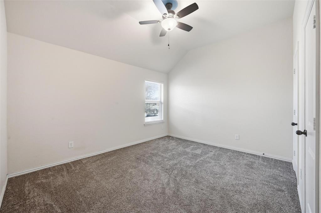 144 Brady Coleman Lane Springtown, TX 76082 - Photo 26 of 37 an empty room with a window and a fan