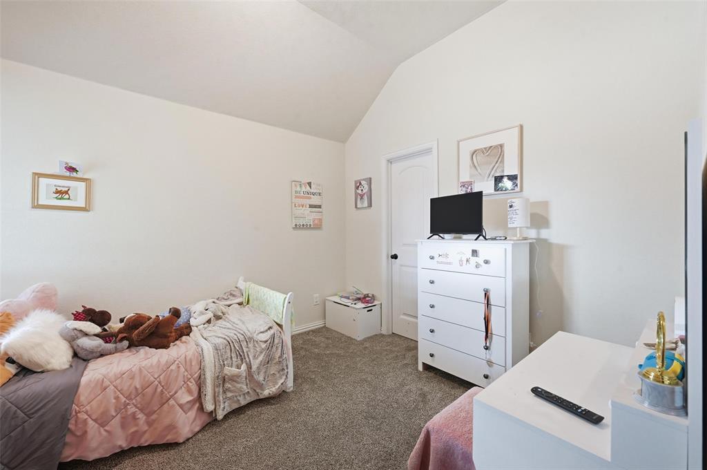 144 Brady Coleman Lane Springtown, TX 76082 - Photo 28 of 37 a bed room with a bed and television