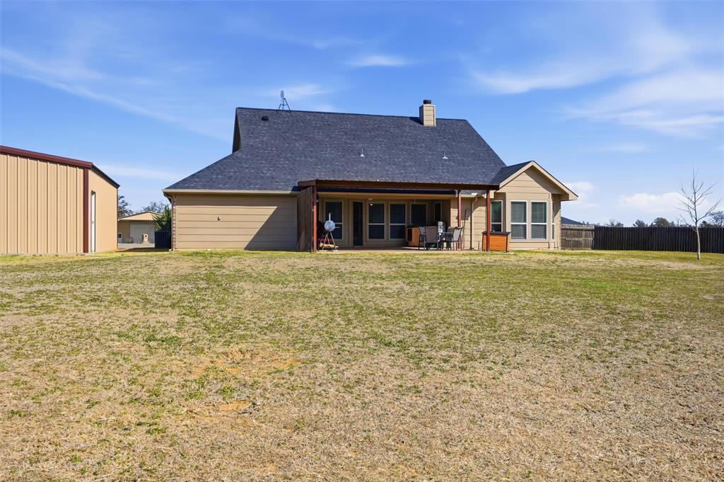 144 Brady Coleman Lane Springtown, TX 76082 - Photo 37 of 37 a house view with a garden space